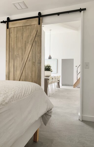 a sliding door to the bedroom